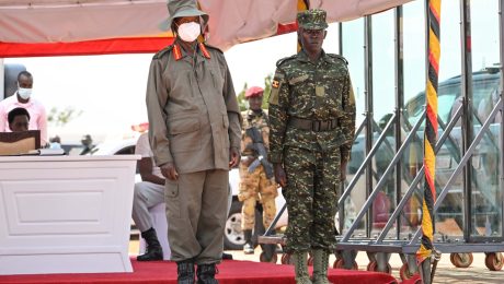 President Museveni poses for a photo with recruit Tarsi Chrispus who received the Chief of Defence Forces